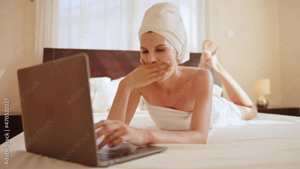 Young woman sleeping next to her laptop computer. Woman sleeping next to her laptop, really tired. Overworked and tired sleeping over a laptop. Bedroom beside laptop notebook computer Young woman sleeping next to her laptop computer. Woman sleeping next to her laptop, really tired. Overworked and tired sleeping over a laptop. Bedroom beside laptop notebook computer