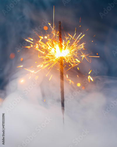 fire sparkler in dense smoke  abstract Christmas firework background