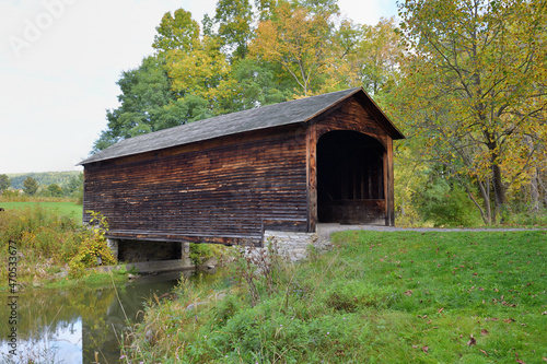 The Hyde Hall Covered Bridge over Shadow Brook in New York's Glimmerglass State Park. The bridge was built in 1825 and is listed on the US Register of Historic Places.