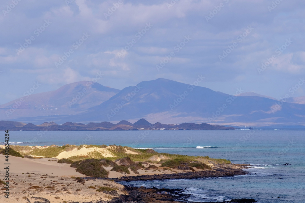 View on the Islands Lobos and Lanzarote from the Corralejo Beach on Fuerteventura.