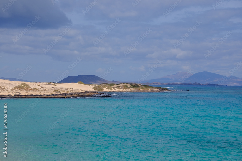 View on the Islands Lobos and Lanzarote from the Corralejo Beach on Fuerteventura.