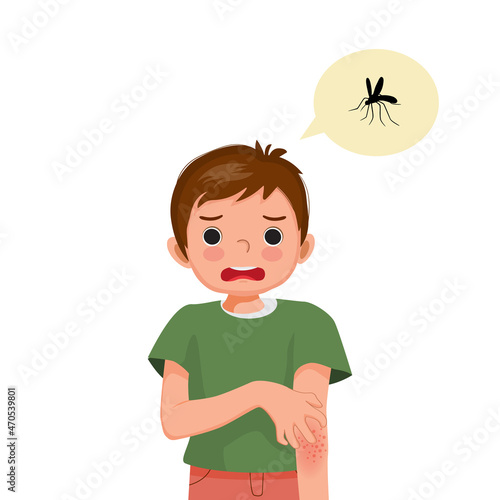 Little boy scratching his hand that has skin rash and swelling redness spot allergy from mosquitoes and insects bites.