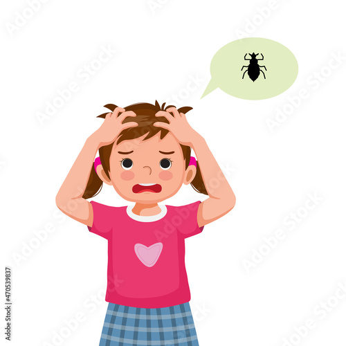 Cute little girl with lice infection on hair scratching her itchy scalp and head.



