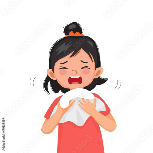 Cute little girl suffering from flu or cold allergy symptom sneezing on a handkerchief or tissue paper.