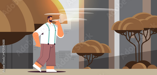 man walking in park and smoking cigarette bad habits unhealthy lifestyle nicotine addiction no smoking concept
