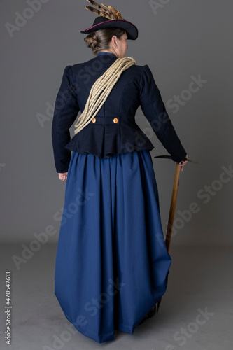 A Victorian woman wearing a mountain climbing ensemble