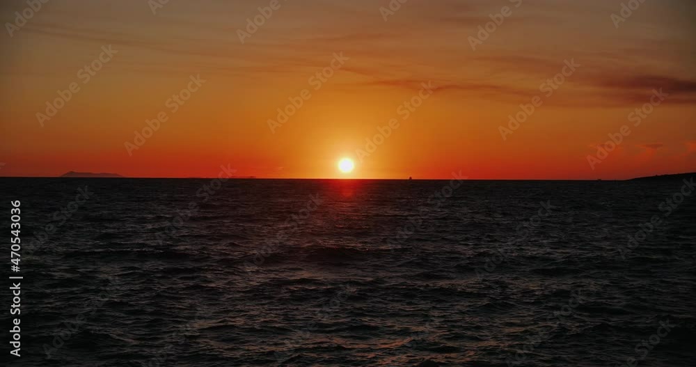Dramatic sea sunrise. Burning sky and shining golden waves. Tropical sea sunrise and waves on exotic beach. Dramatic sea sunrise. Burning sky and shining golden waves. Tropical sea sunrise and waves on exotic beach.