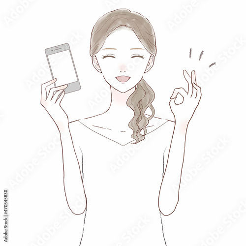 スマホを持ってOKサインを出している女性