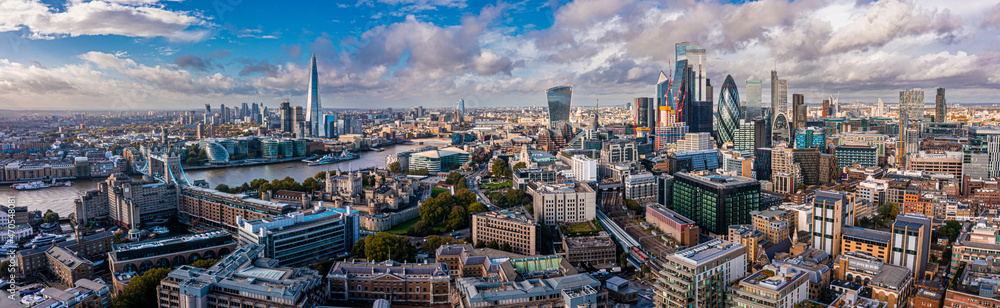 Aerial panoramic scene of the London city financial district with many iconic skyscrapers near river Thames. - obrazy, fototapety, plakaty 