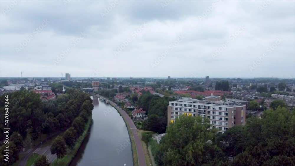 Aerial shot of elderly home along river flowing through suburbs of Leiden, the Netherlands Aerial shot of elderly home along river flowing through suburbs of Leiden, the Netherlands