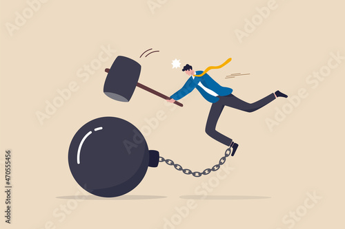 Break free or breaking bad habits or routines for freedom, pay off debt, destroy shackle or anxiety burden, escape and liberation concept, confidence businessman use hammer to break heavy chain burden