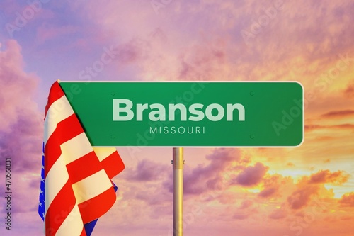 Branson - Missouri/USA. Road or City Sign. Flag of the united states. Sunset Sky. photo