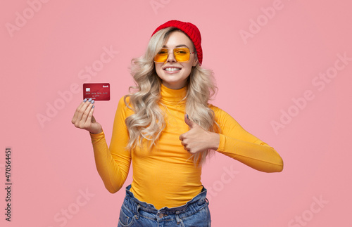 Stylish woman approving credit card