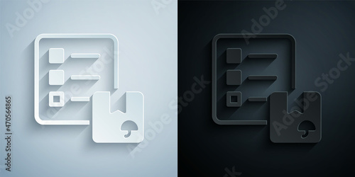 Paper cut Verification of delivery list clipboard icon isolated on grey and black background. Paper art style. Vector