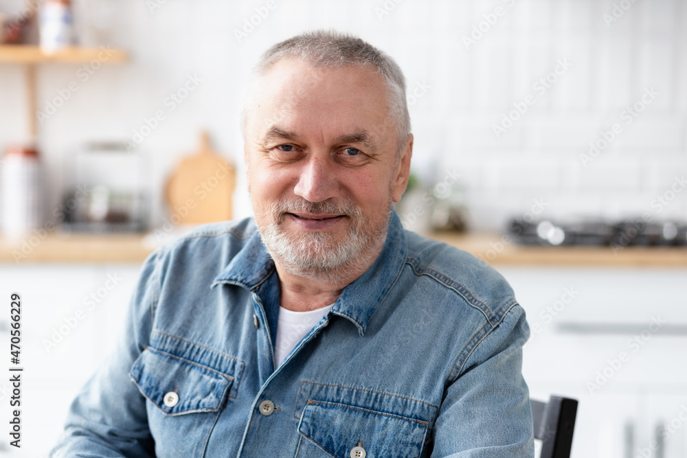 Portrait of happy senior man looking at camera Portrait of happy senior man looking at camera