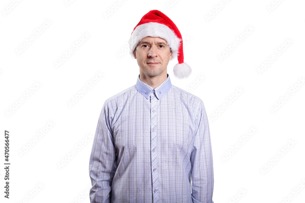 A handsome adult man looks into the camera, dressed in casual clothes, a light plaid shirt, a New Year's cap. Isolated A handsome adult man looks into the camera, dressed in casual clothes, a light plaid shirt, a New Year's cap. Isolated