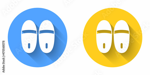 White Slippers icon isolated with long shadow background. Flip flops sign. Circle button. Vector