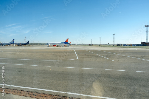 Several planes parked at the airport on loading