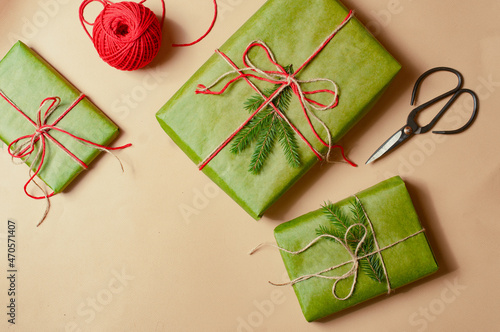 Presents scissors and thread for pacing top view christmas concept sale beige minimalistic background