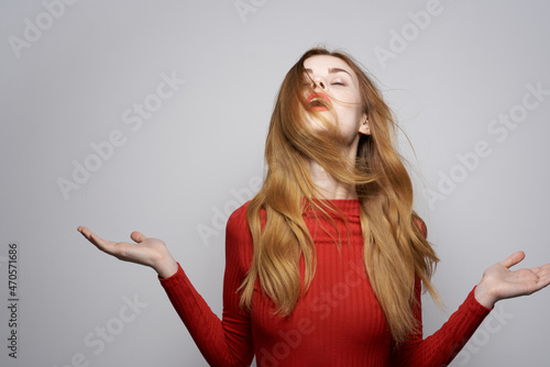 pretty woman in red dress posing luxury hand gesture isolated background