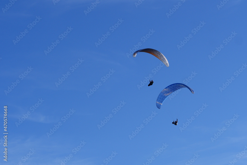 Paraglider flying over mountains in summer day in front of the mountain, High quality photo Paraglider flying over mountains in summer day in front of the mountain, High quality photo