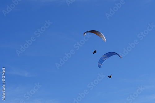 Paraglider flying over mountains in summer day in front of the mountain, High quality photo