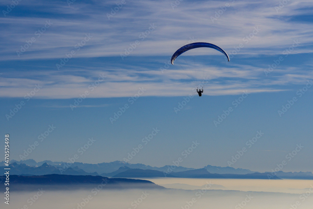 Paraglider flying over mountains in summer day in front of the mountain, High quality photo Paraglider flying over mountains in summer day in front of the mountain, High quality photo