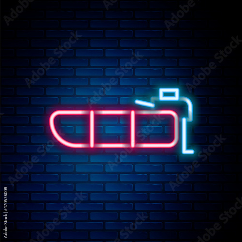 Glowing neon line Inflatable boat with outboard motor icon isolated on brick wall background. Colorful outline concept. Vector