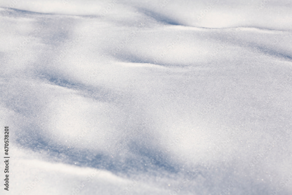 Snowy background in winter. White shiny bright snow. Snowy background in winter. White shiny bright snow.