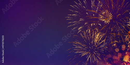  Festive new years fireworks in the dark night sky, banner for website with copy space for text