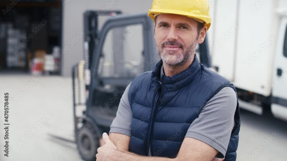 Portrait of caucasian mature man in front of warehouse. Shot with RED helium camera in 8K. Portrait of caucasian mature man in front of warehouse. Shot with RED helium camera in 8K.