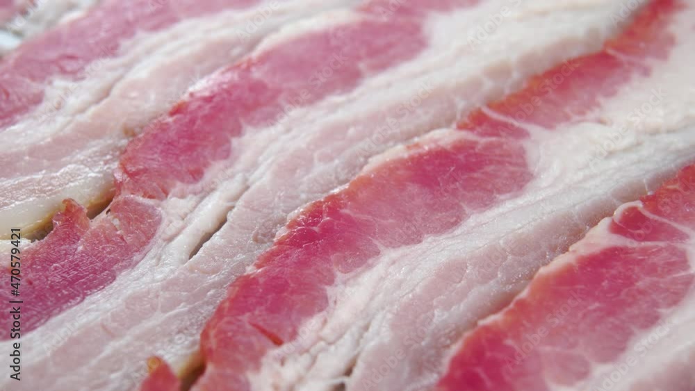 Sliced fresh cooked bacon. Macro shot. Slow rotation Sliced fresh cooked bacon. Macro shot. Slow rotation
