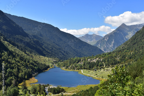 Beautiful mountains,blue lake,green valley,forest.Bright breathtaking,thrilling view in summer,spring,sunny weather.Aiguestortes national park,Spain,Pyrenees photo