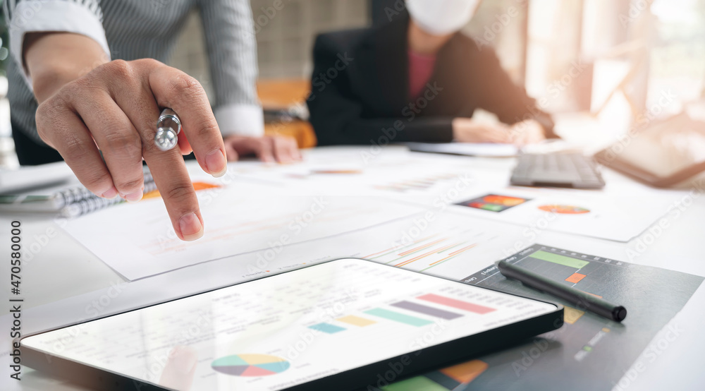 Fototapeta premium Businesswoman working at office with document on her desk, doing planning analyzing the financial report, business plan investment, finance analysis concept.