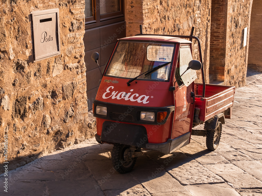 Montalcino, Italy - August 12 2021: Piaggio Ape 50 Mini Car or three  wheeled light commercial vehicle. Stock Photo