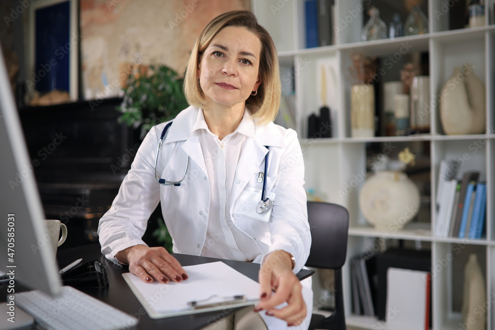 Middle aged female doctor therapist on consultation. Middle aged female doctor therapist on consultation.