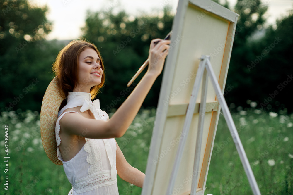 woman artist outdoors painting nature hobby art