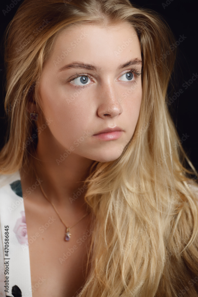 Portrait of beautiful sensual woman with blue eyes. Studio shot. Portrait of beautiful sensual woman with blue eyes. Studio shot.