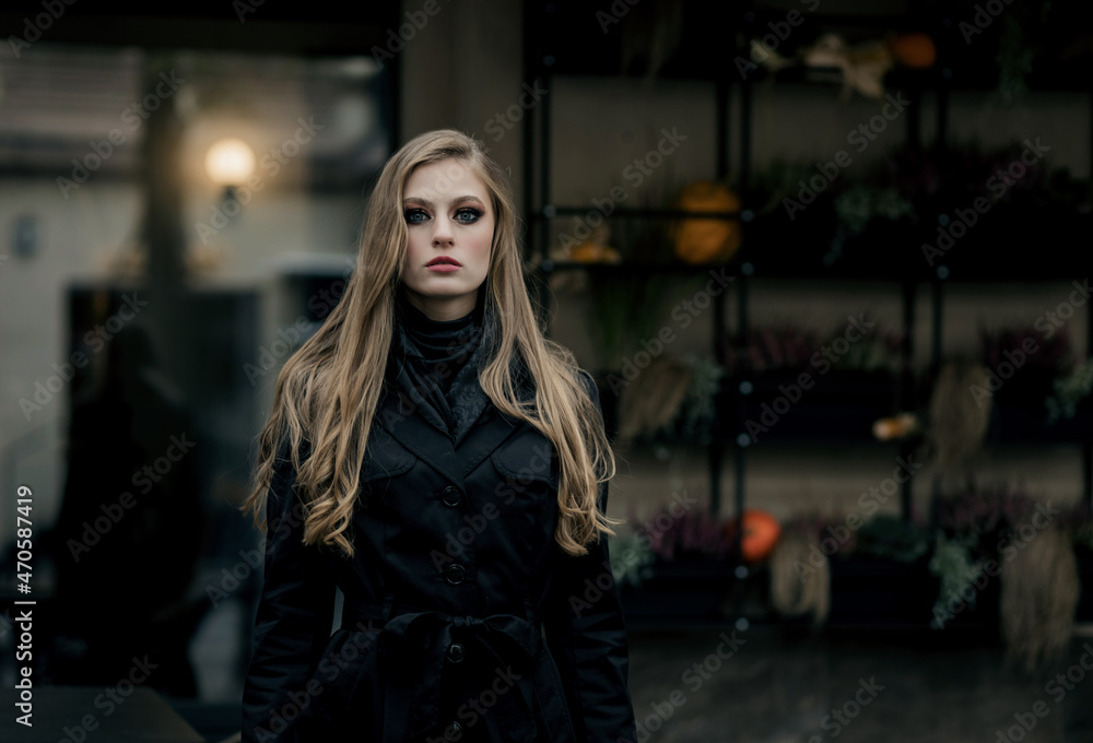 Fashionable young woman in a coat