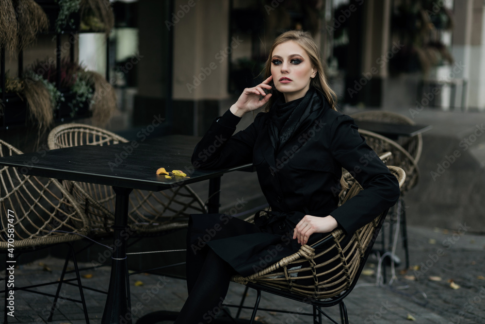 Beautiful young stylish girl in coat
