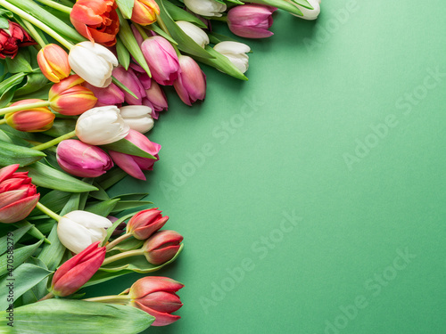 Fotobehang Colorful tulip bouquet on green background.