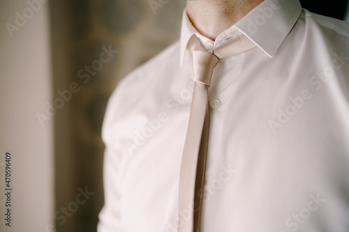 Man in a tie and white shirt. Close-up