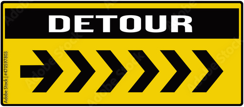 A sign that indicates the detour in black and  yellow color. photo