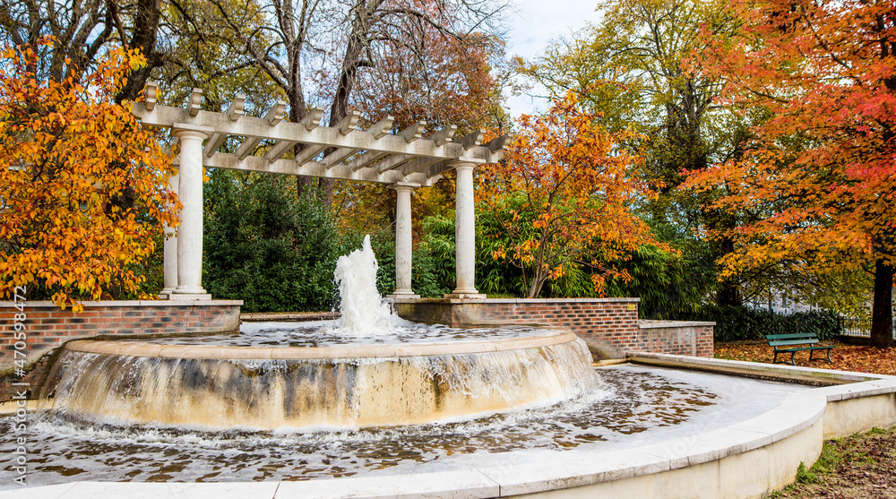 nice landscape with a fountain in an autumn park