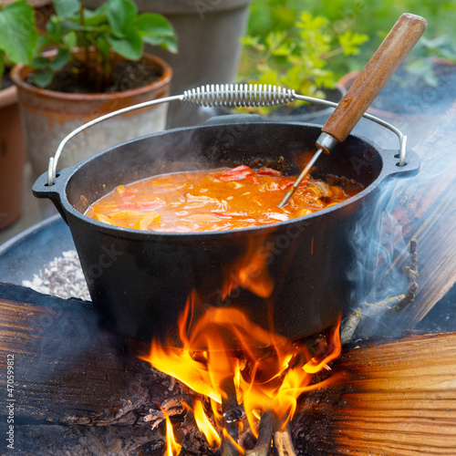 Kettle goulash is prepared over an open fire! photo