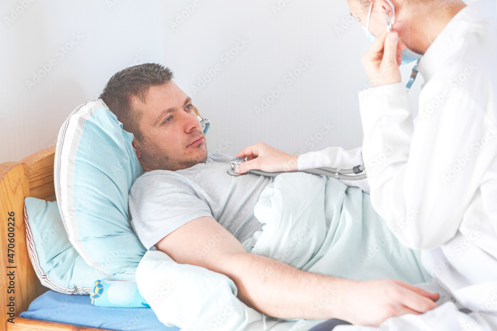 Doctor use stethoscope, checking up heart beat. Patient worker has to get medical checkup every year for her health or medical checkup cardiologist Doctor use stethoscope, checking up heart beat. Patient worker has to get medical checkup every year for her health or medical checkup cardiologist