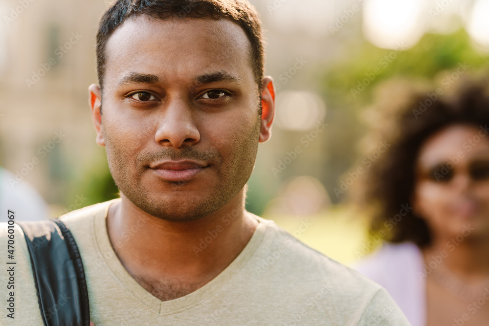 Middle eastern man looking at camera while standing outdoors Middle eastern man looking at camera while standing outdoors