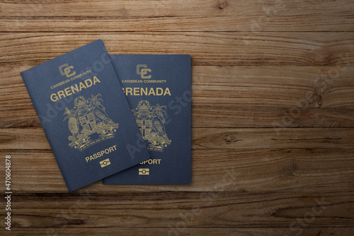 grenada passport on wooden background citizenship by investment