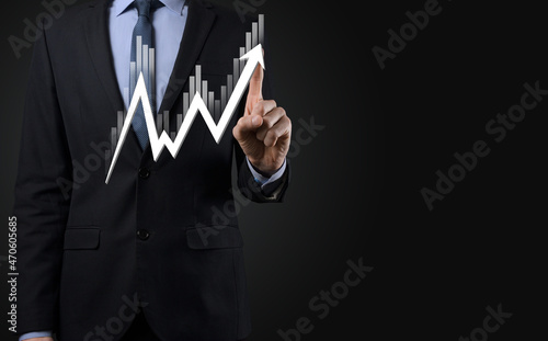 Businessman hold sales data and economic growth graph chart. Business planning and strategy. Analysing trading of exchange. Financial and banking. Technology digital marketing.Profit and growing plan.