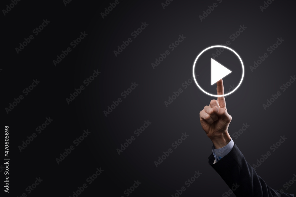 Businessman pressing, hold play button sign to start or initiate projects.Video Play Presentation. Idea for business, technology.media player button. Play icon.Go. Businessman pressing, hold play button sign to start or initiate projects.Video Play Presentation. Idea for business, technology.media player button. Play icon.Go.